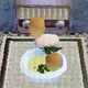 eggs and chicken stacked vertically atop one another in a bowl